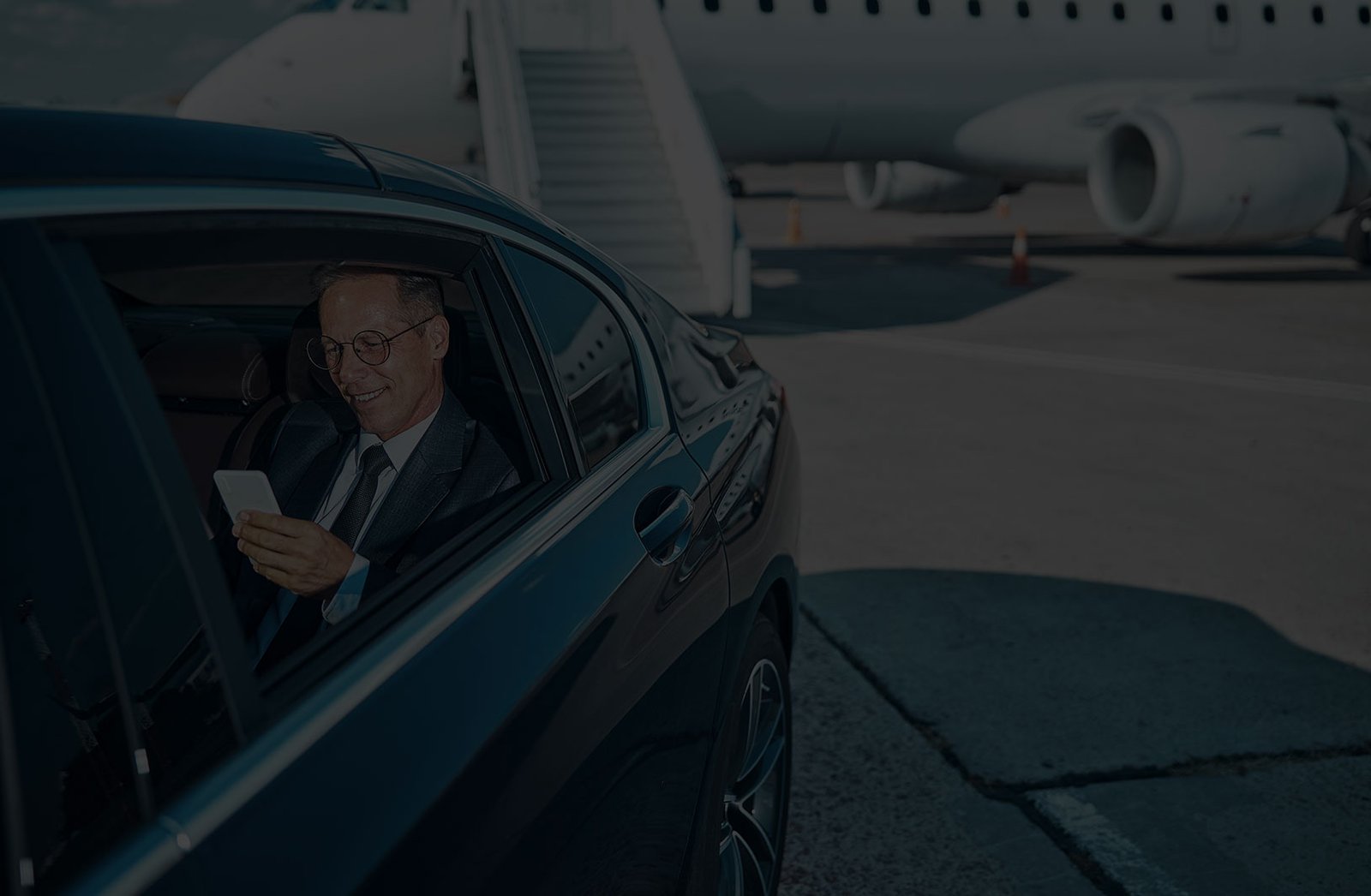 Picture of a person being picked up in a lucury vehicle at Charlotte Douglas International Airport